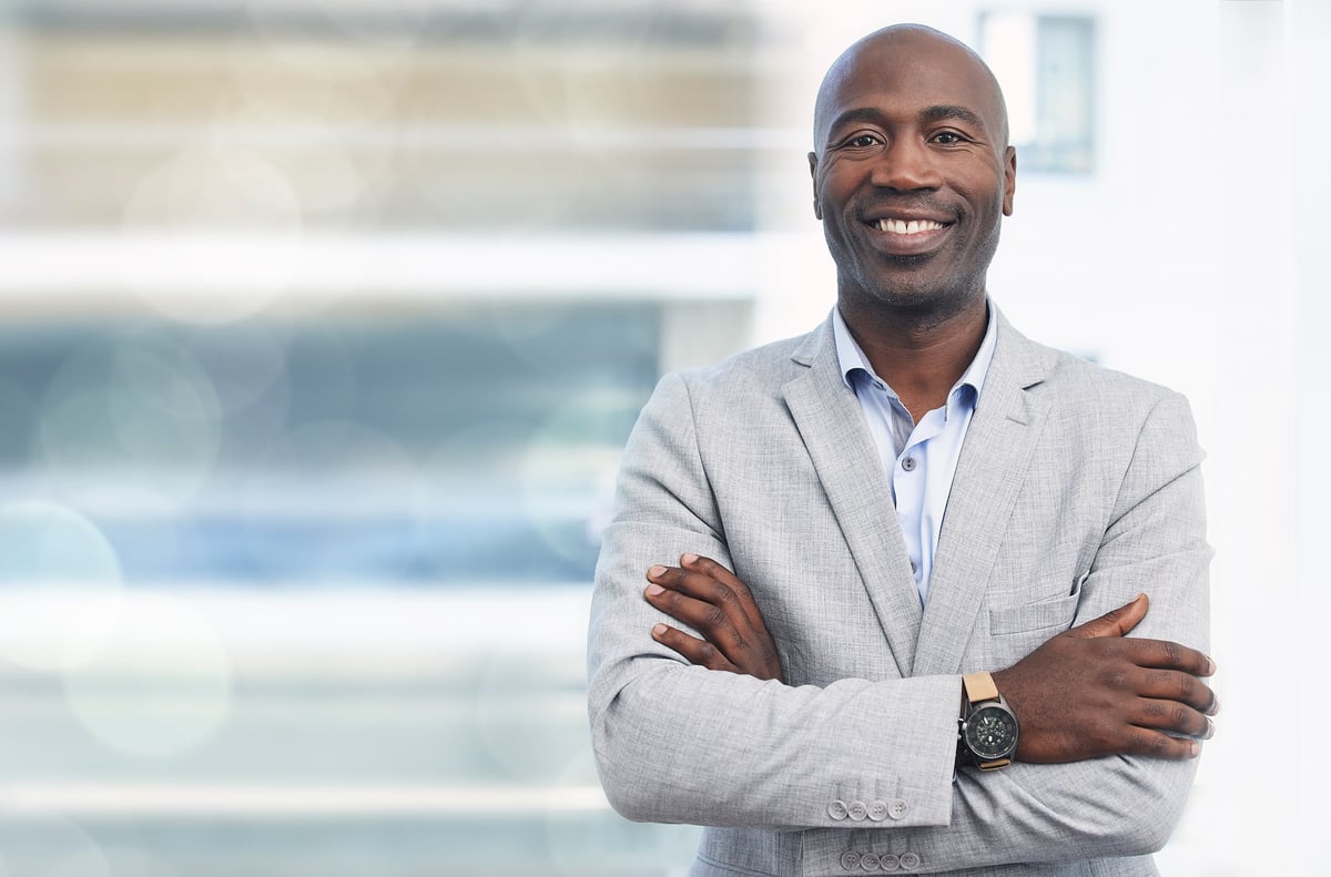 Smile, leadership and portrait of black man, confident ceo with mockup and blurred background. Vision, future and proud businessman, leader in growth and development of business in corporate Africa.